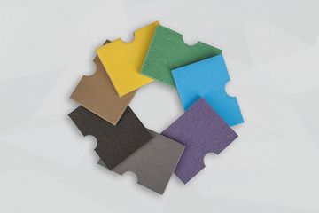 Bunte Muster von Schwingungsisolierungen im Kreis gelegt