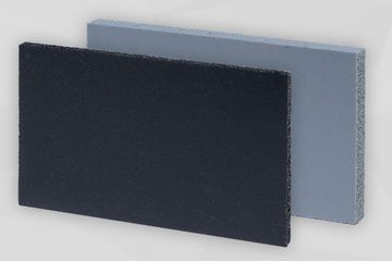 Schwarzes und graues Dichtungsprodukt stehend vor grauem Hintergrund